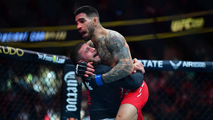 Feb 17, 2024; Anaheim, California, USA; Ilia Topuria celebrates his championship victory against Alexander Volkanovski during UFC 298 at Honda Center. Mandatory Credit: Gary A. Vasquez-Imagn Images