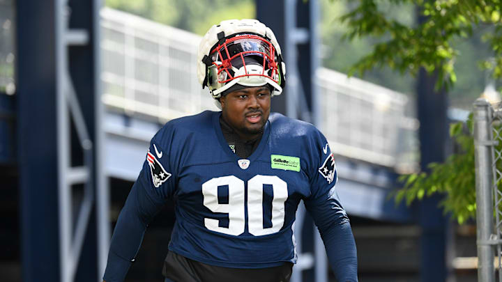 Jul 30, 2022; Foxborough, MA, USA; New England Patriots defensive end Christian Barmore (90) walks to the practice field at the Patriots training camp at Gillette Stadium. Mandatory Credit: Eric Canha-Imagn Images Jul 30, 2022; Foxborough, MA, USA; New England Patriots defensive end Christian Barmore (90) walks to the practice field at the Patriots training camp at Gillette Stadium. Mandatory Credit: Eric Canha-Imagn Images