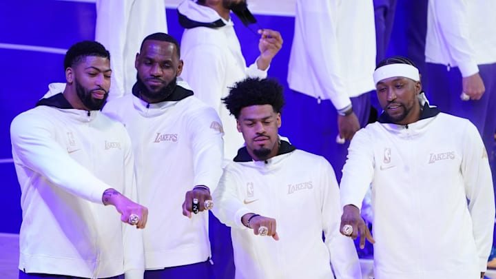 Dec 22, 2020; Los Angeles, California, USA; Los Angeles Lakers players Anthony Davis and LeBron James and Quinn Cook and Kentavious Caldwell-Pope pose with their 2020 NBA Championship rings before a game against the Los Angeles Clippers at Staples Center. Mandatory Credit: Kirby Lee-Imagn Images