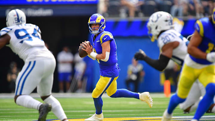Sep 28, 2025; Inglewood, California, USA; Los Angeles Rams quarterback Matthew Stafford (9) moves out to pass against the Indianapolis Colts during the first half at SoFi Stadium. Mandatory Credit: Gary A. Vasquez-Imagn Images