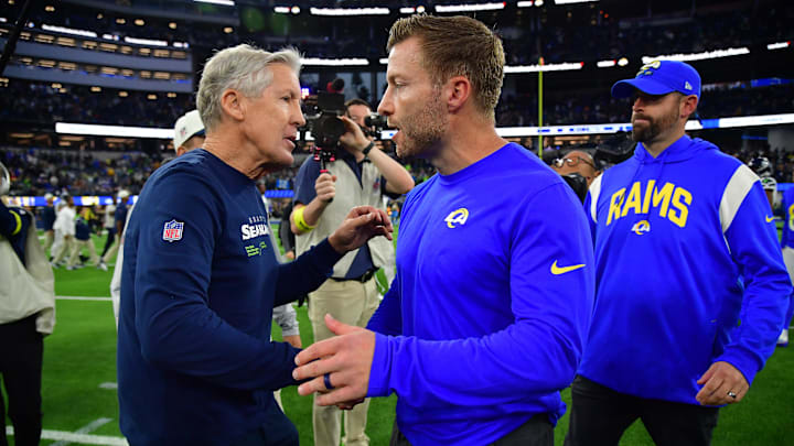 Dec 4, 2022; Inglewood, California, USA; Seattle Seahawks head coach Pete Carroll meets with Los Angeles Rams head coach Sean McVay following the game at SoFi Stadium. Mandatory Credit: Gary A. Vasquez-Imagn Images