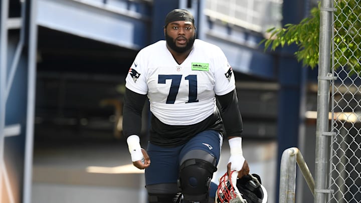 Jul 30, 2022; Foxborough, MA, USA; New England Patriots guard Mike Onwenu (71) walks to the practice