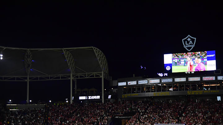 August 4, 2024; Carson, California, USA; Chivas and LA Galaxy players stand midfield for penalty kicks at Dignity Health Sports Park. Mandatory Credit: Gary A. Vasquez-Imagn Images