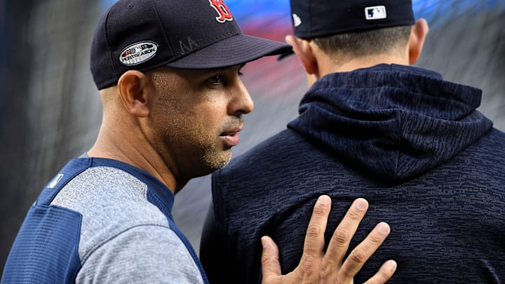 Red Sox manager Cora, left, talks with Yankees manager Boone during batting practice before Game 3 of the 2018 American League Division Series. Red Sox manager Cora, left, talks with Yankees manager Boone during batting practice before Game 3 of the 2018 American League Division Series.