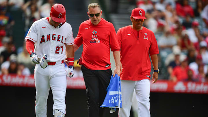 Mike Trout left a game against the Mariners on Sunday after he was hit by a pitch for the second time in the weekend series. Mike Trout left a game against the Mariners on Sunday after he was hit by a pitch for the second time in the weekend series.