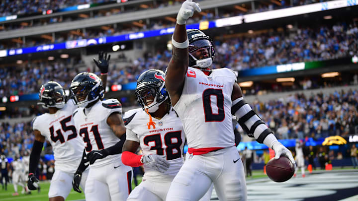 Dec 27, 2025; Inglewood, California, USA; Houston Texans linebacker Azeez al-Shaair (0) reacts with safety K'Von Wallace (38) after making an interception against the Los Angeles Chargers during the first half at SoFi Stadium. Mandatory Credit: Gary A. Vasquez-Imagn Images Dec 27, 2025; Inglewood, California, USA; Houston Texans linebacker Azeez al-Shaair (0) reacts with safety K'Von Wallace (38) after making an interception against the Los Angeles Chargers during the first half at SoFi Stadium. Mandatory Credit: Gary A. Vasquez-Imagn Images