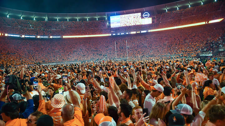 Fans storm the field after Tennessee's 52-49 win over Alabama in Neyland Stadium, on Saturday, Oct. 15, 2022