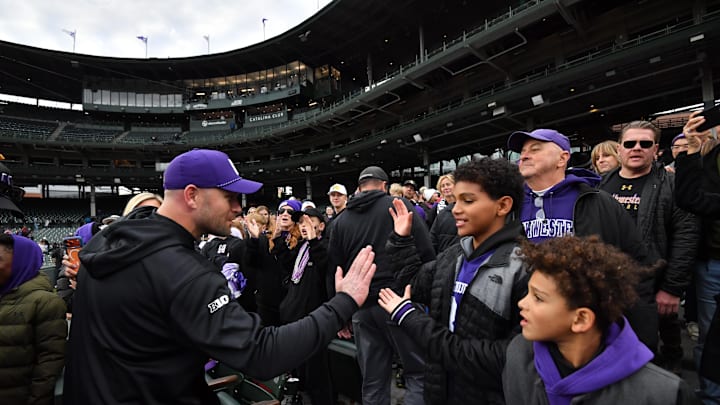 Nov 22, 2025; Chicago, Illinois, USA; Northwestern Wildcats head coach David Braun celebrates with young fans after his team’s victory against the Minnesota Golden Gophers at Wrigley Field. Mandatory Credit: Patrick Gorski-Imagn Images