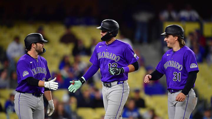 Colorado Rockies third baseman Kyle Karros greeted by catcher Braxton Fulford and center fielder Jake McCarthy 