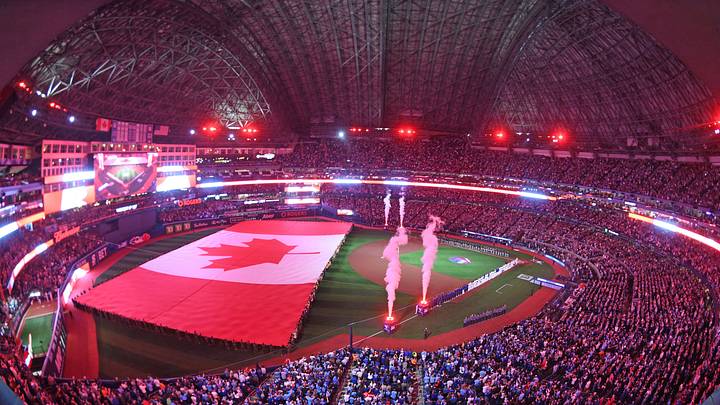 Apr 8, 2024; Toronto, Ontario, CAN; The Canadian flag is unfurled during the anthems as the Toronto Blue Jays play their home opener against the Seattle Mariners at Rogers Centre. Mandatory Credit: Dan Hamilton-USA TODAY Sports Apr 8, 2024; Toronto, Ontario, CAN; The Canadian flag is unfurled during the anthems as the Toronto Blue Jays play their home opener against the Seattle Mariners at Rogers Centre. Mandatory Credit: Dan Hamilton-USA TODAY Sports