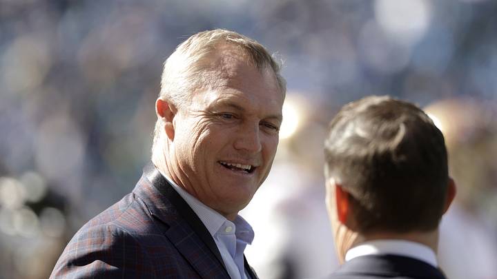 Seattle, Washington, USA;  San Francisco 49ers general manager John Lynch chats on the field before a game against the Seattle Seahawks at Lumen Field.  Mandatory Credit: Joe Nicholson-Imagn Images