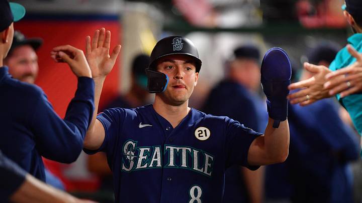 Sep 15, 2026; Anaheim, California, USA; Seattle Mariners designated hitter Dominic Canzone (8) is greeted after hitting an RBI double against the Los Angeles Angels during the sixth inning at Angel Stadium. Mandatory Credit: Gary A. Vasquez-Imagn Images