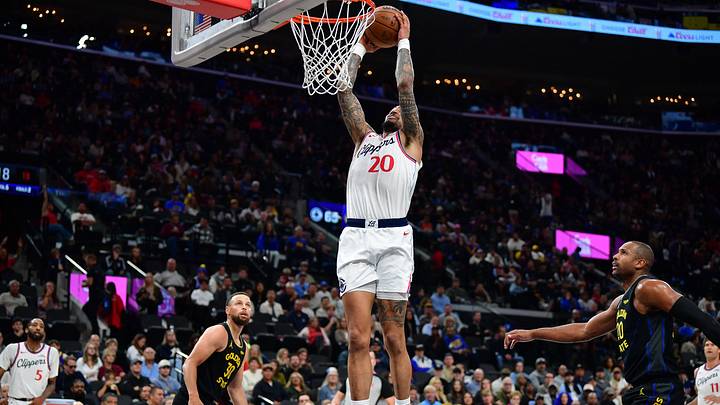 Apr 12, 2026; Inglewood, California, USA; Los Angeles Clippers forward John Collins (20) scores a basket against the Golden State Warriors during the second half at Intuit Dome. Mandatory Credit: Gary A. Vasquez-Imagn Images