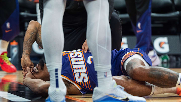 Nov 10, 2024; Phoenix, Arizona, USA; Phoenix Suns guard Bradley Beal (3) reacts after getting hit and falling during overtime during a game against the Sacramento Kings at Footprint Center. Mandatory Credit: Allan Henry-Imagn Images