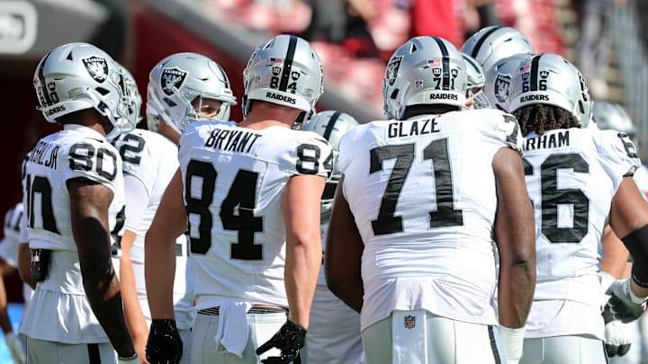 Dec 8, 2024; Tampa, Florida, USA; Las Vegas Raiders quarterback Aidan O'Connell (12) and teammates huddle up before the game against the Tampa Bay Buccaneers at Raymond James Stadium. Mandatory Credit: Kim Klement Neitzel-Imagn Images Dec 8, 2024; Tampa, Florida, USA; Las Vegas Raiders quarterback Aidan O'Connell (12) and teammates huddle up before the game against the Tampa Bay Buccaneers at Raymond James Stadium. Mandatory Credit: Kim Klement Neitzel-Imagn Images