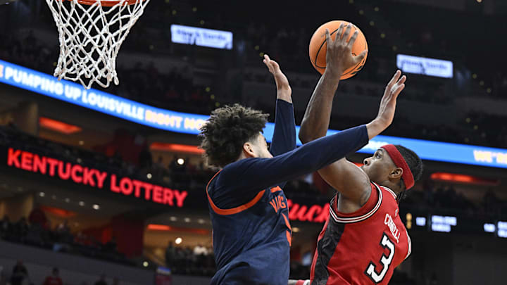 Jan 13, 2026; Louisville, Kentucky, USA; Louisville Cardinals guard Ryan Conwell (3) shoots against Virginia Cavaliers guard Sam Lewis (5) during the second half at KFC Yum! Center. Virginia defeated Louisville 79-70. Mandatory Credit: Jamie Rhodes-Imagn Images Jan 13, 2026; Louisville, Kentucky, USA; Louisville Cardinals guard Ryan Conwell (3) shoots against Virginia Cavaliers guard Sam Lewis (5) during the second half at KFC Yum! Center. Virginia defeated Louisville 79-70. Mandatory Credit: Jamie Rhodes-Imagn Images