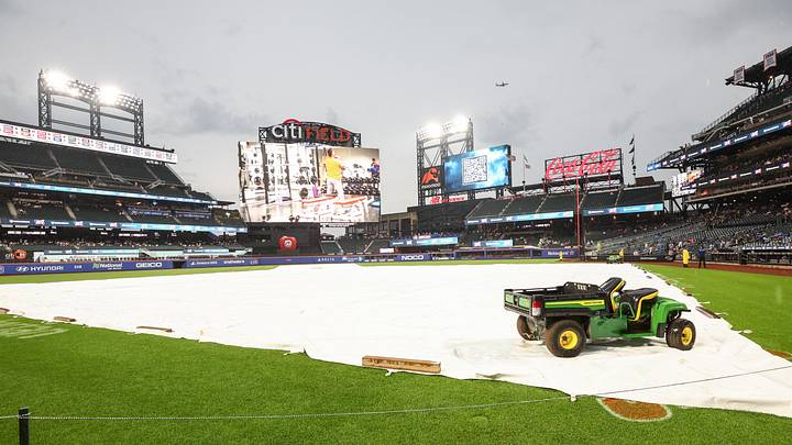 Aug 13, 2025; New York City, New York, USA; The tarp iis placed on the field during a rain delay prior to the game between the Atlanta Braves and the New York Mets at Citi Field. Mandatory Credit: Wendell Cruz-Imagn Images Aug 13, 2025; New York City, New York, USA; The tarp iis placed on the field during a rain delay prior to the game between the Atlanta Braves and the New York Mets at Citi Field. Mandatory Credit: Wendell Cruz-Imagn Images