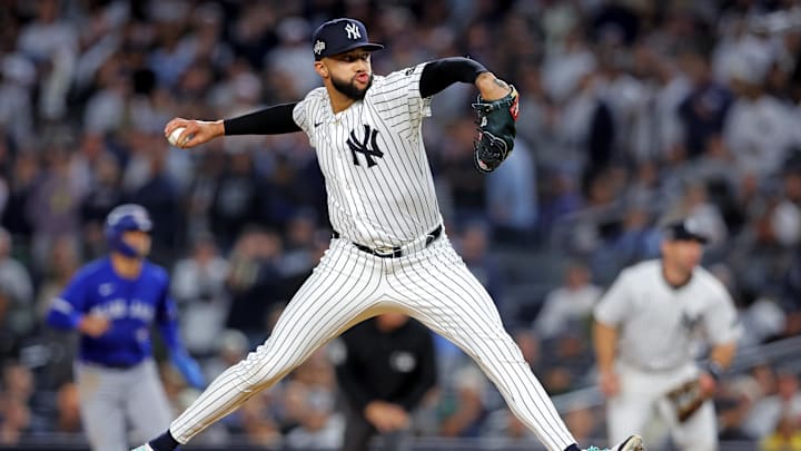 Oct 8, 2025; Bronx, New York, USA; New York Yankees pitcher Devin Williams (38) pitches during the seventh inning against the Toronto Blue Jays during game four of the ALDS round for the 2025 MLB playoffs at Yankee Stadium. Mandatory Credit: Brad Penner-Imagn Images