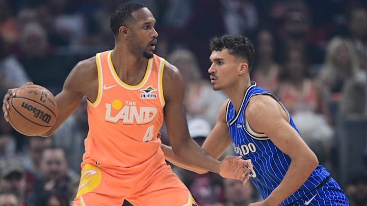 Mar 24, 2026; Cleveland, Ohio, USA; Cleveland Cavaliers center Evan Mobley (4) dribbles against Orlando Magic forward Tristan da Silva (23) during the first half at Rocket Arena. Mandatory Credit: David Dermer-Imagn Images