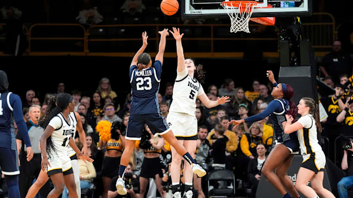 Iowa center Ava Heiden (5) defends a shot attempted by Penn State guard Kiyomi McMiller (23) Dec. 28, 2025 at Carver-Hawkeye Arena in Iowa City, Iowa.