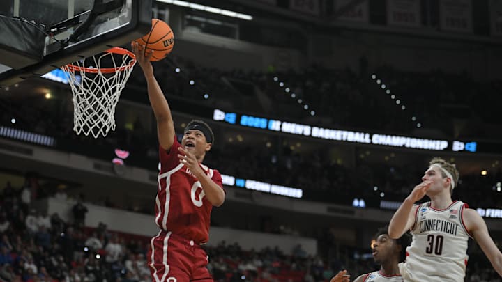 Oklahoma Sooners guard Jeremiah Fears puts up shot against Connecticut Huskies forward Liam McNeeley