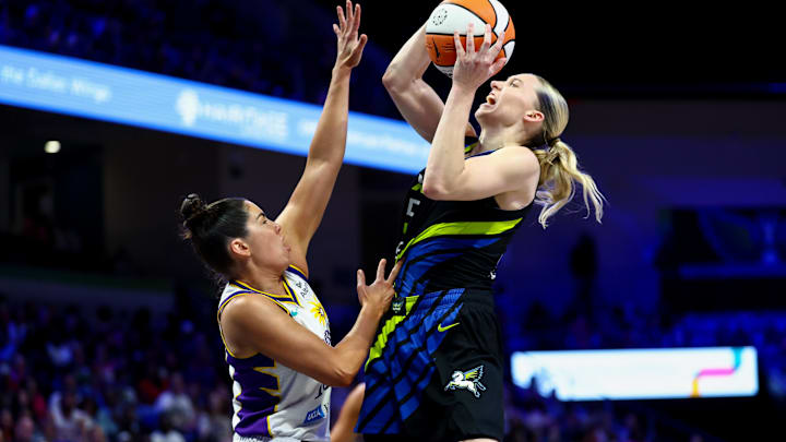 Aug 15, 2025; Arlington, Texas, USA; Dallas Wings guard Paige Bueckers (5) shoots over Los Angeles Sparks guard Kelsey Plum (10) during the second half at College Park Center. Mandatory Credit: Kevin Jairaj-Imagn Images Aug 15, 2025; Arlington, Texas, USA; Dallas Wings guard Paige Bueckers (5) shoots over Los Angeles Sparks guard Kelsey Plum (10) during the second half at College Park Center. Mandatory Credit: Kevin Jairaj-Imagn Images