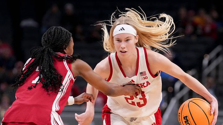 Britt Prince pushes past Indiana guard Jerni Kiaku during a Big Ten tournament game last season. 