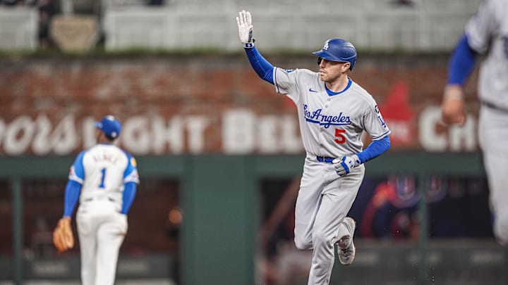 May 3, 2025; Cumberland, Georgia, USA; Los Angeles Dodgers first baseman Freddie Freeman (5) reacts after hitting a three run home run against the Atlanta Braves during the eighth inning at Truist Park. Mandatory Credit: Dale Zanine-Imagn Images