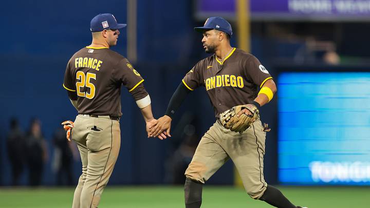 Jul 25, 2026; Miami, Florida, USA; San Diego Padres first baseman Ty France (25) and shortstop Xander Bogaerts (2) celebrate after the game against the Miami Marlins at loanDepot Park. Mandatory Credit: Sam Navarro-Imagn Images