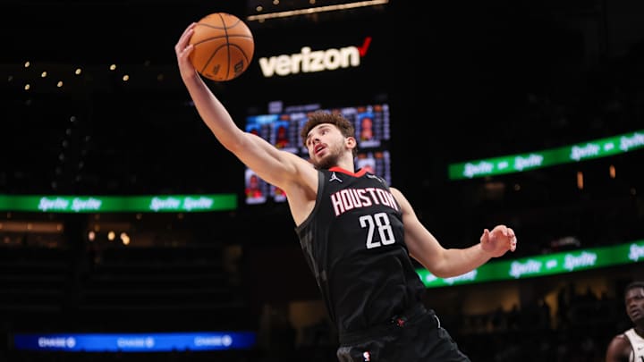 Jan 28, 2025; Atlanta, Georgia, USA; Houston Rockets center Alperen Sengun (28) grabs a rebound against the Atlanta Hawks in the second quarter at State Farm Arena. Mandatory Credit: Brett Davis-Imagn Images