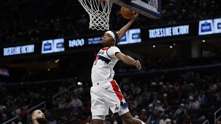 Dec 19, 2024; Washington, District of Columbia, USA; Washington Wizards guard Bilal Coulibaly (0) dunks the ball as Charlotte Hornets forward Cody Martin (11) looks on in the fourth quarter at Capital One Arena. Mandatory Credit: Geoff Burke-Imagn Images Dec 19, 2024; Washington, District of Columbia, USA; Washington Wizards guard Bilal Coulibaly (0) dunks the ball as Charlotte Hornets forward Cody Martin (11) looks on in the fourth quarter at Capital One Arena. Mandatory Credit: Geoff Burke-Imagn Images