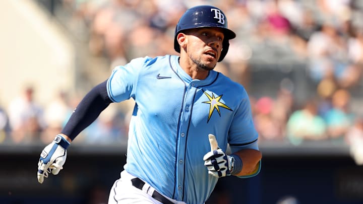 Feb 27, 2024; Port Charlotte, Florida, USA; Tampa Bay Rays catcher Rene Pinto (50) singles during the third inning against the New York Yankees at Charlotte Sports Park.