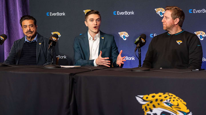 Jacksonville Jaguars Owner Shad Khan, left, listens as Jacksonville Jaguars General Manager James Gladstone, center, explained what he was bringing to the table during a press conference Monday morning February 24, 2025 at the Miller Electric Center in Jacksonville, Fla. as Head Coach Liam Coen, right, listened. [Doug Engle/Florida Times-Union]2025