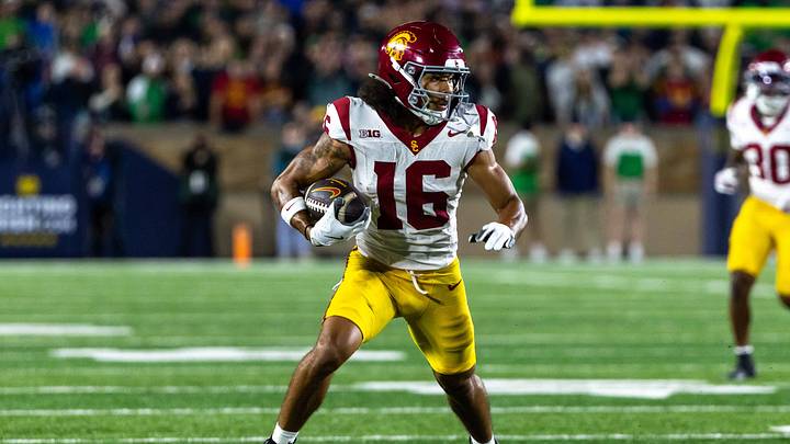 Oct 18, 2025; South Bend, Indiana, USA;  Southern California Trojans wide receiver Tanook Hines (16) runs the ball against the Notre Dame Fighting Irish during the first half  at Notre Dame Stadium. Mandatory Credit: Michael Caterina-Imagn Images