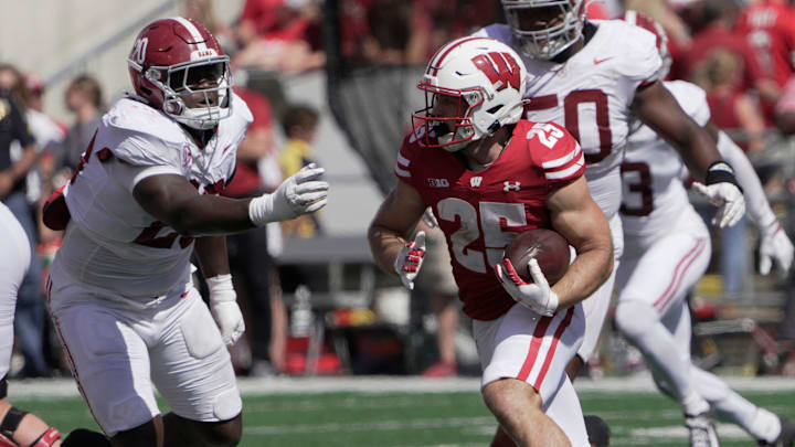 Wisconsin running back Cade Yacamelli (25) looks for an opening during the third quarter of their game Saturday, September 14, 2024 at Camp Randall Stadium in Madison, Wisconsin.