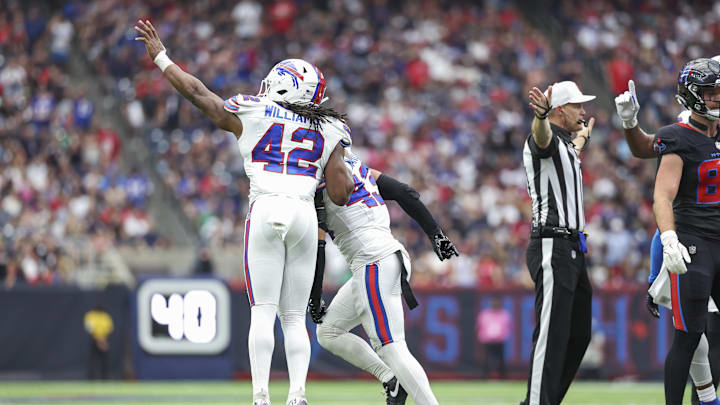 Oct 6, 2024; Houston, Texas, USA; Buffalo Bills linebacker Dorian Williams (42) and linebacker Terrel Bernard (43) celebrate after a defensive stop against the Houston Texans during the second quarter at NRG Stadium.  