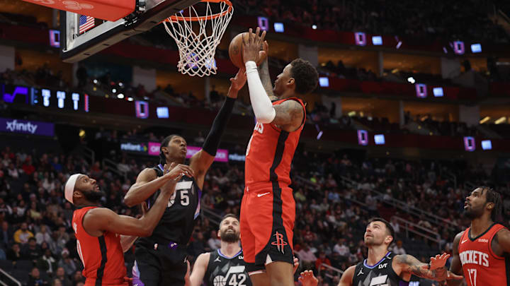 Feb 23, 2026; Houston, Texas, USA; Houston Rockets forward Jabari Smith Jr. (10) grabs a defensive rebound against Utah Jazz forward Cody Williams (5)  in the second quarter at Toyota Center. Mandatory Credit: Thomas Shea-Imagn Images