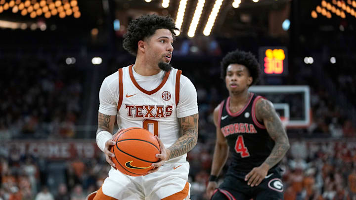 Jan 24, 2026; Austin, Texas, USA; Texas Longhorns guard Jordan Pope (0) looks to pass against Georgia Bulldogs guard Marcus Millender (4) during the second half at Moody Center. Mandatory Credit: Dustin Safranek-Imagn Images Jan 24, 2026; Austin, Texas, USA; Texas Longhorns guard Jordan Pope (0) looks to pass against Georgia Bulldogs guard Marcus Millender (4) during the second half at Moody Center. Mandatory Credit: Dustin Safranek-Imagn Images