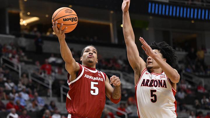 Mar 26, 2026; San Jose, CA, USA; Arkansas Razorbacks guard Darius Acuff Jr. (5) shoots past Arizona Wildcats guard Brayden Burries (5) in the second half during a Sweet Sixteen game of the West Regional of the men's 2026 NCAA Tournament at SAP Center. Mandatory Credit: Eakin Howard-Imagn Images