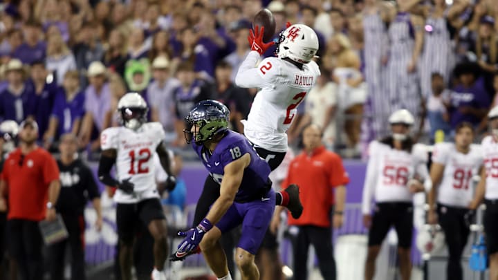 Oct 4, 2024; Fort Worth, Texas, USA; Houston Cougars defensive back A.J. Haulcy (2) intercepts a pass while defending TCU Horned Frogs wide receiver Jack Bech (18) in the second quarter at Amon G. Carter Stadium. Mandatory Credit: Tim Heitman-Imagn Images Oct 4, 2024; Fort Worth, Texas, USA; Houston Cougars defensive back A.J. Haulcy (2) intercepts a pass while defending TCU Horned Frogs wide receiver Jack Bech (18) in the second quarter at Amon G. Carter Stadium. Mandatory Credit: Tim Heitman-Imagn Images