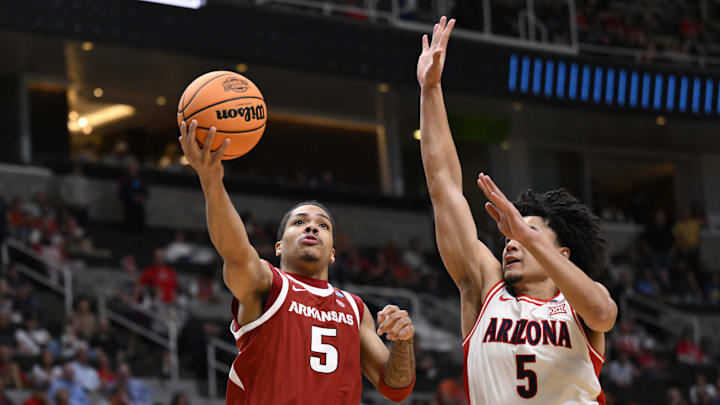 Mar 26, 2026; San Jose, CA, USA; Arkansas Razorbacks guard Darius Acuff Jr. (5) shoots past Arizona Wildcats guard Brayden Burries (5) in the second half during a Sweet Sixteen game of the West Regional of the men's 2026 NCAA Tournament at SAP Center. Mandatory Credit: Eakin Howard-Imagn Images