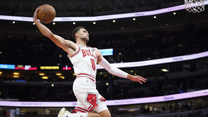 Oct 12, 2023; Chicago, Illinois, USA; Chicago Bulls guard Zach LaVine (8) goes up for a dunk against the Denver Nuggets during the first half at United Center. 