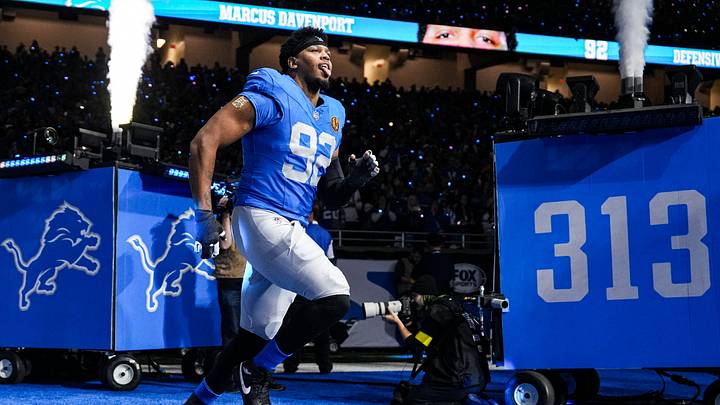 Detroit Lions defensive end Marcus Davenport (92) runs onto the field for players introduction before the Thanksgiving game against Green Bay Packers at Ford Field in Detroit on Thursday, Nov. 27, 2025. Detroit Lions defensive end Marcus Davenport (92) runs onto the field for players introduction before the Thanksgiving game against Green Bay Packers at Ford Field in Detroit on Thursday, Nov. 27, 2025.
