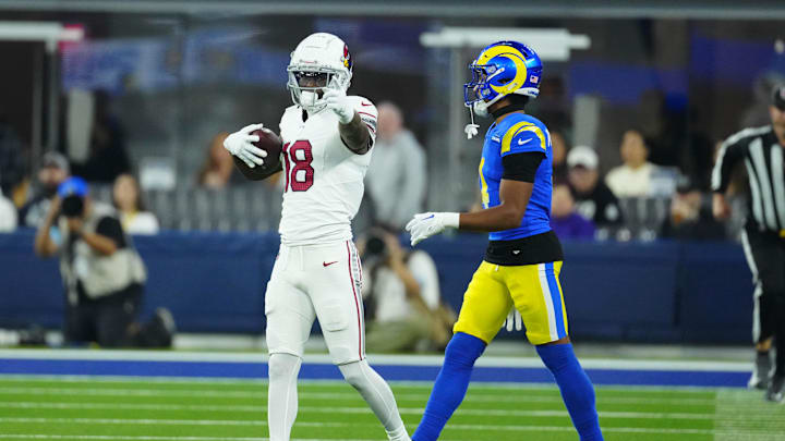 Dec 28, 2024; Inglewood, California, USA; Arizona Cardinals wide receiver Marvin Harrison Jr. (18) gestures after catching the ball against Los Angeles Rams cornerback Ahkello Witherspoon (4) in the first half at SoFi Stadium. Mandatory Credit: Kirby Lee-Imagn Images Dec 28, 2024; Inglewood, California, USA; Arizona Cardinals wide receiver Marvin Harrison Jr. (18) gestures after catching the ball against Los Angeles Rams cornerback Ahkello Witherspoon (4) in the first half at SoFi Stadium. Mandatory Credit: Kirby Lee-Imagn Images