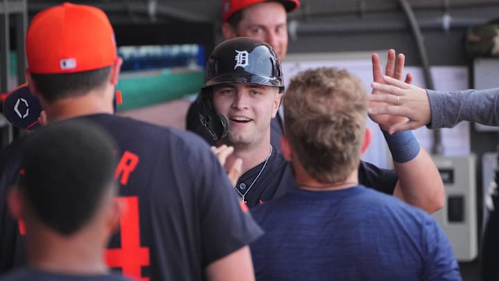 Tigers second baseman Jace Jung (84) is congratulated as he returns to the dugout.