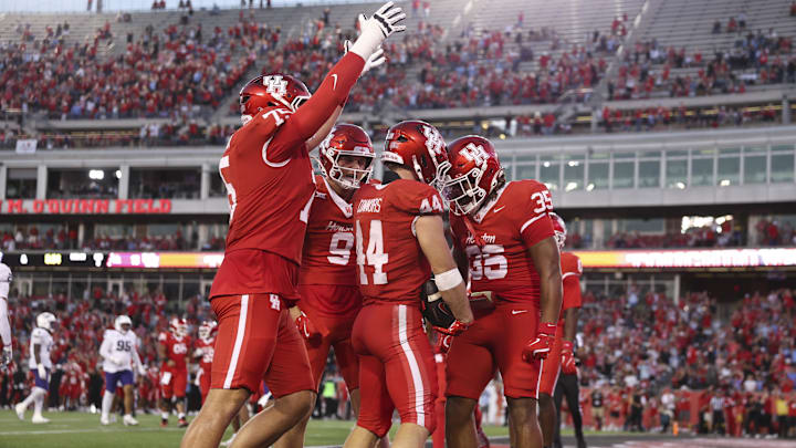 Nov 22, 2025; Houston, Texas, USA; Houston Cougars running back Dean Connors (44) celebrates with teammates after scoring a touchdown during the third quarter against the TCU Horned Frogs at TDECU Stadium. Mandatory Credit: Troy Taormina-Imagn Images