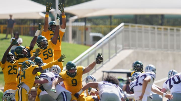 Oct 4, 2025; Waco, Texas, USA; Baylor Bears defensive lineman Cooper Lanz (9) blocks a field goal attempt by Kansas State Wildcats quarterback Blake Barnett (13) at the end of the second half at McLane Stadium. Mandatory Credit: Chris Jones-Imagn Images Oct 4, 2025; Waco, Texas, USA; Baylor Bears defensive lineman Cooper Lanz (9) blocks a field goal attempt by Kansas State Wildcats quarterback Blake Barnett (13) at the end of the second half at McLane Stadium. Mandatory Credit: Chris Jones-Imagn Images