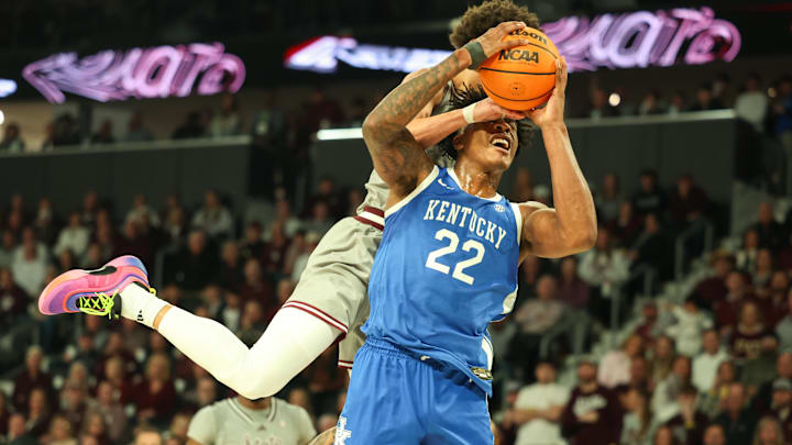 Jan 11, 2025; Starkville, Mississippi, USA; Kentucky Wildcats center Amari Williams (22) is fouled by Mississippi State Bulldogs guard Riley Kugel (2) during the first half at Humphrey Coliseum. Mandatory Credit: Wesley Hale-Imagn Images