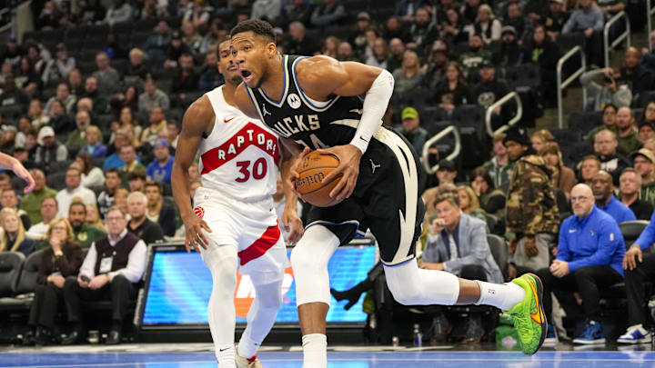 Nov 12, 2024; Milwaukee, Wisconsin, USA; Milwaukee Bucks forward Giannis Antetokounmpo (34) drives for the basket around Toronto Raptors guard Ochai Agbaji (30) during the fourth quarter at Fiserv Forum. Mandatory Credit: Jeff Hanisch-Imagn Images Nov 12, 2024; Milwaukee, Wisconsin, USA; Milwaukee Bucks forward Giannis Antetokounmpo (34) drives for the basket around Toronto Raptors guard Ochai Agbaji (30) during the fourth quarter at Fiserv Forum. Mandatory Credit: Jeff Hanisch-Imagn Images