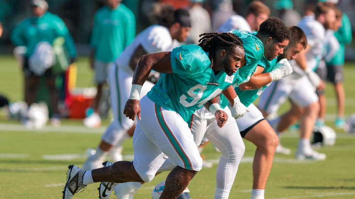 Jul 29, 2025; Miami Gardens, FL, USA; Miami Dolphins defensive tackle Jordan Phillips (94) runs on the field during training camp at Baptist Health Training Complex. Mandatory Credit: Sam Navarro-Imagn Images